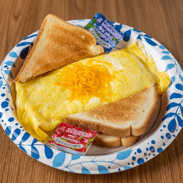 Bacon and Cheese Omelet with Toast.